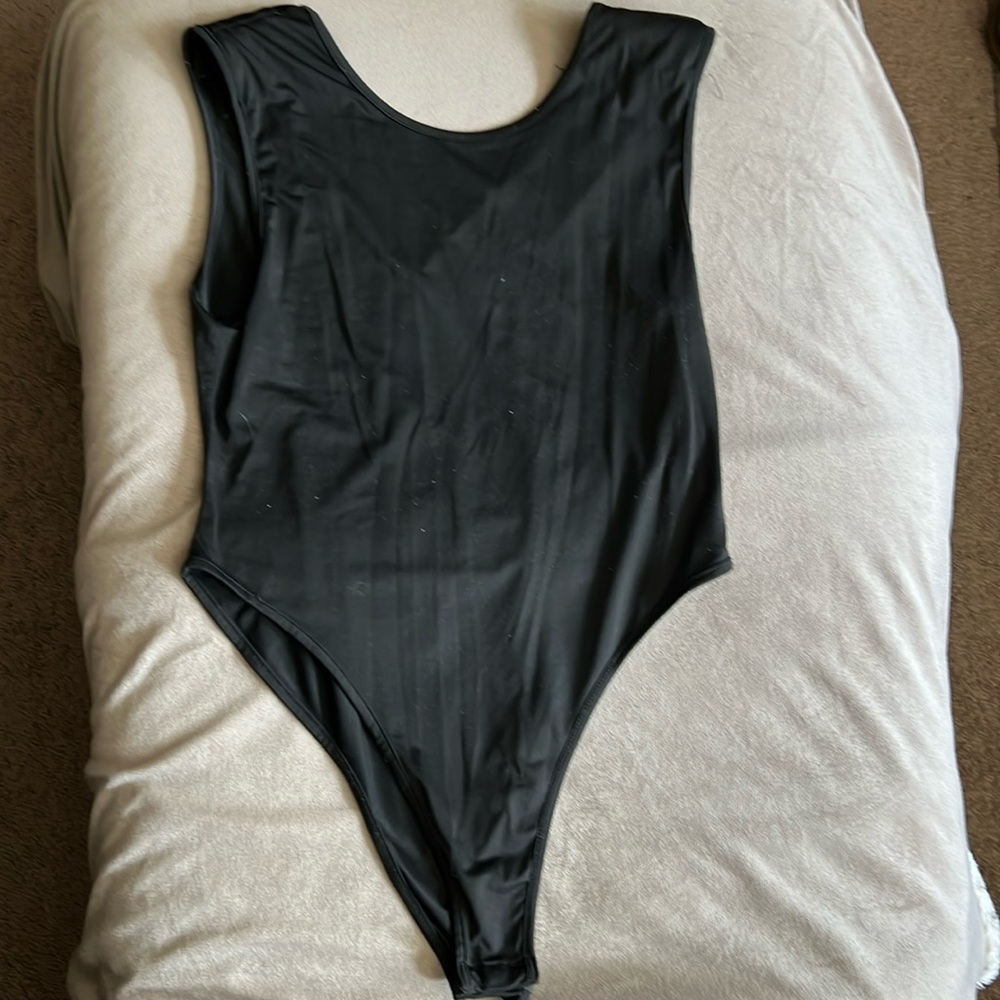 Black tank body suit with back cut outs